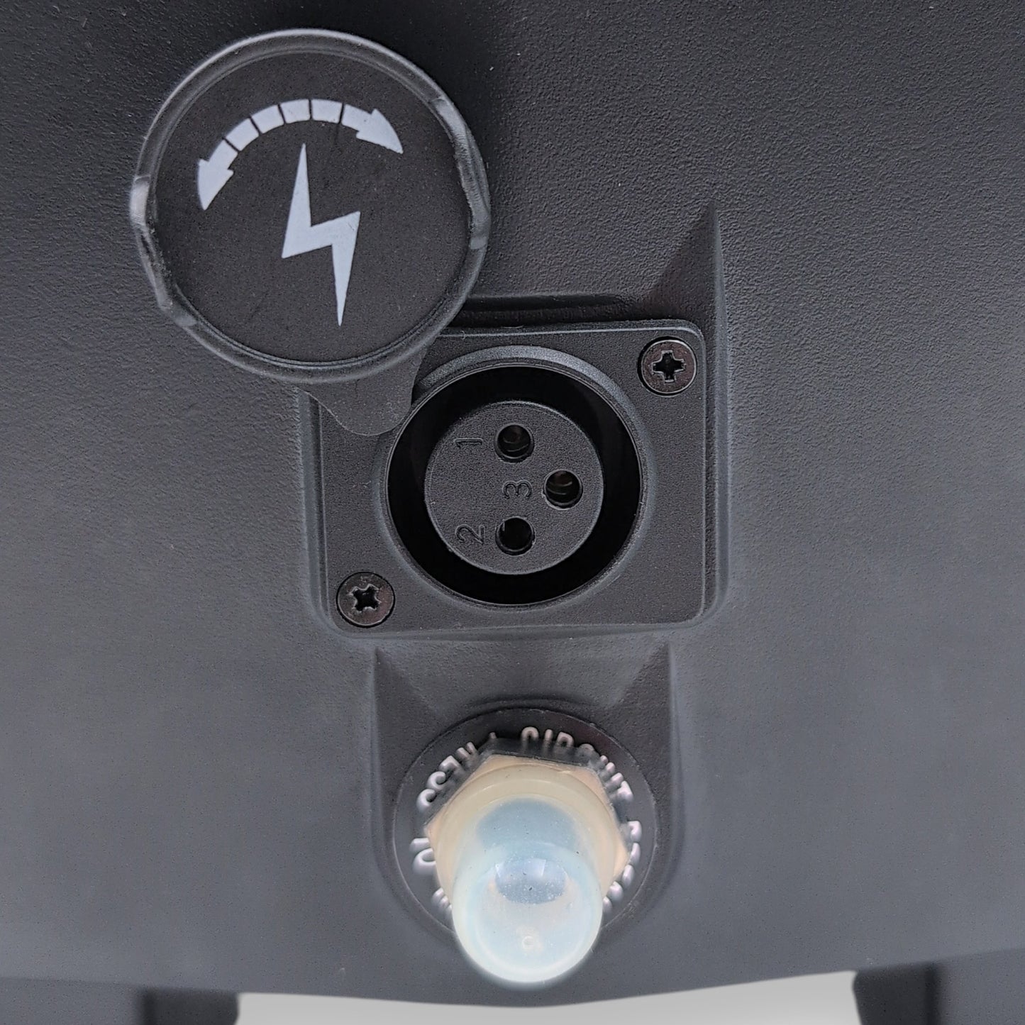 XRL charging port with cover removed and circuit breaker resest switch