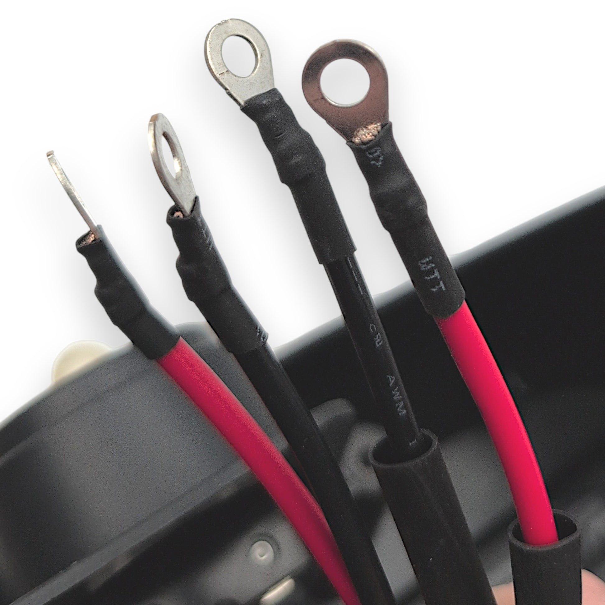 closeup of the four ring terminals used to connect the batteries to the box