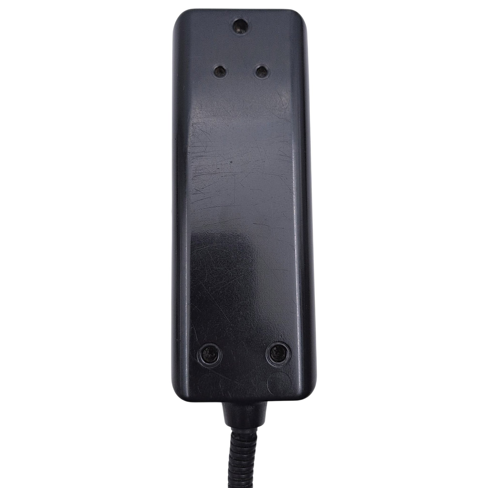 closeup of the back of the remote hand control. Also shows 5 screw holes and the cable stay.