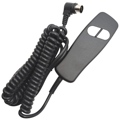 remote / hand control with 2 buttons and cable wound up. 90 degree connector and its 5 pins are in view