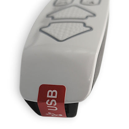 top view of remote with factory label over usb port