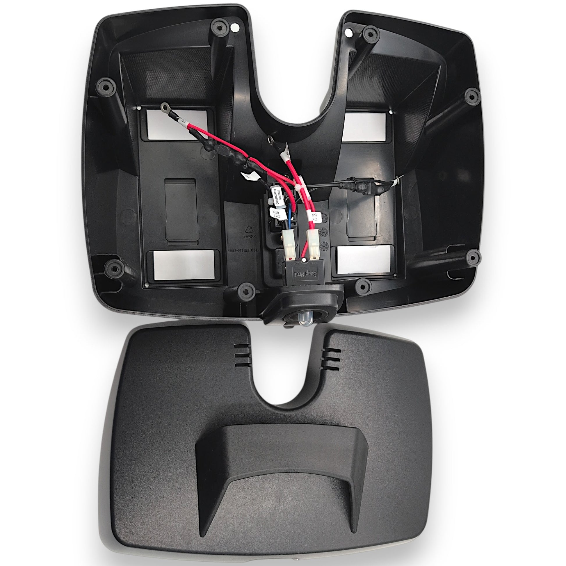 top view of empty battery pack with lid next to it