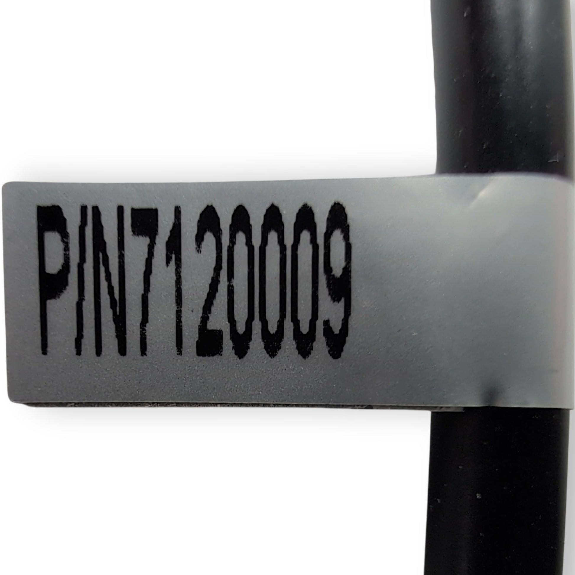 label found on cord near connector. States: part Number: 7120009