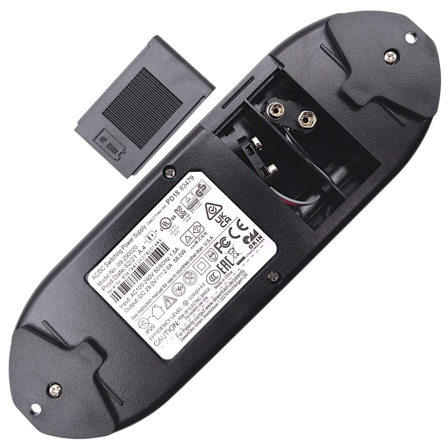 bottom of power supply with battery door removed showing compartment for (2) 9 Volt Batteries