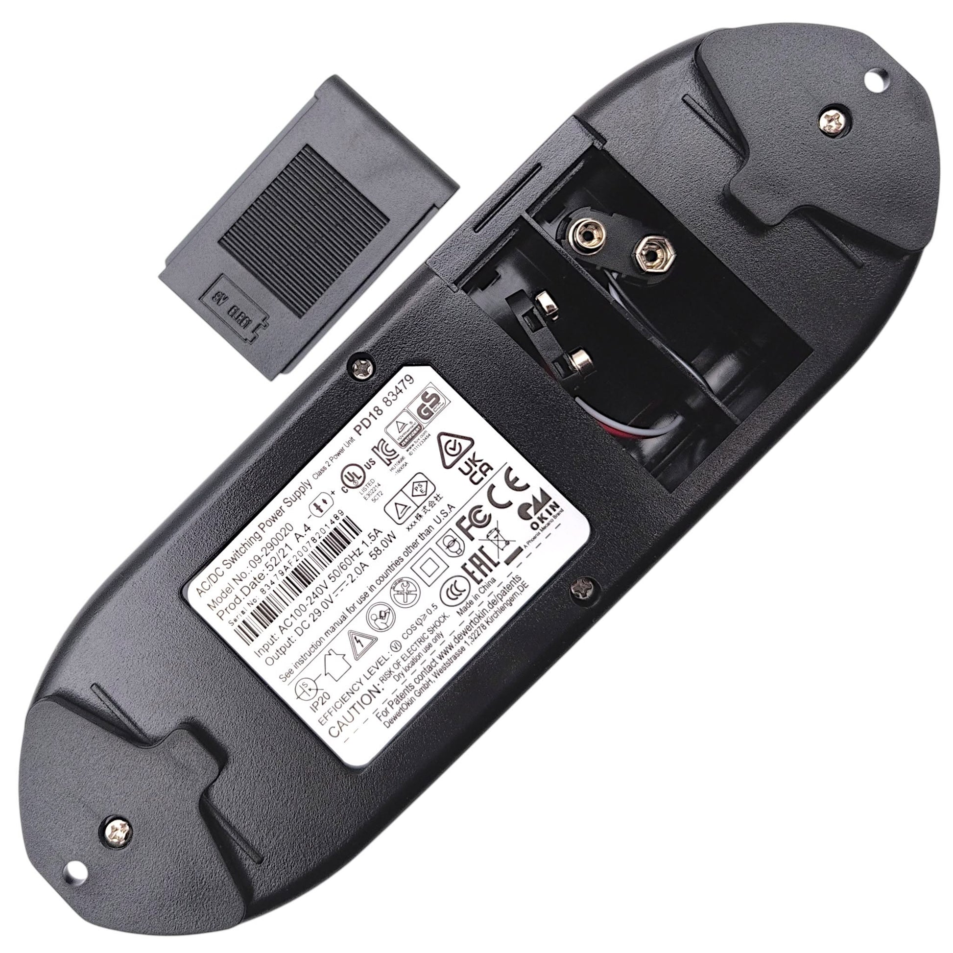 bottom of power supply with battery door removed showing compartment for (2) 9 Volt Batteries